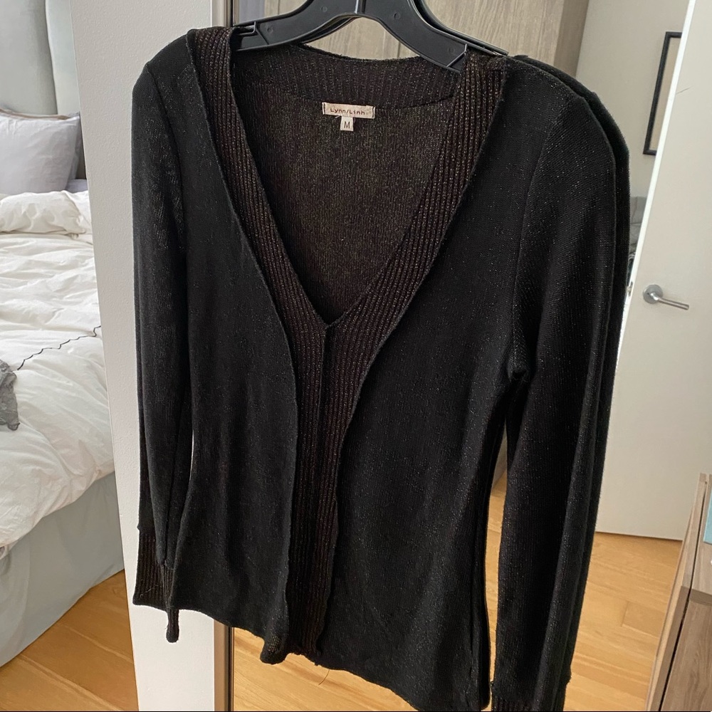 Sweater with gold metallic thread.